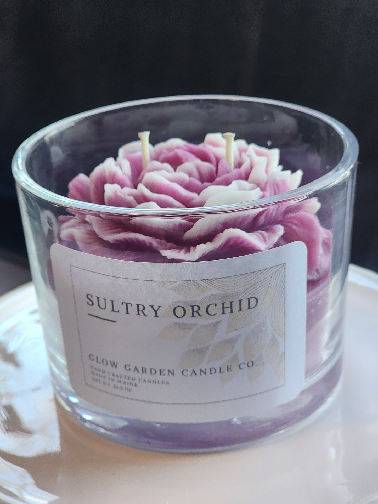 Sultry Orchid 10.5 oz candle with flower