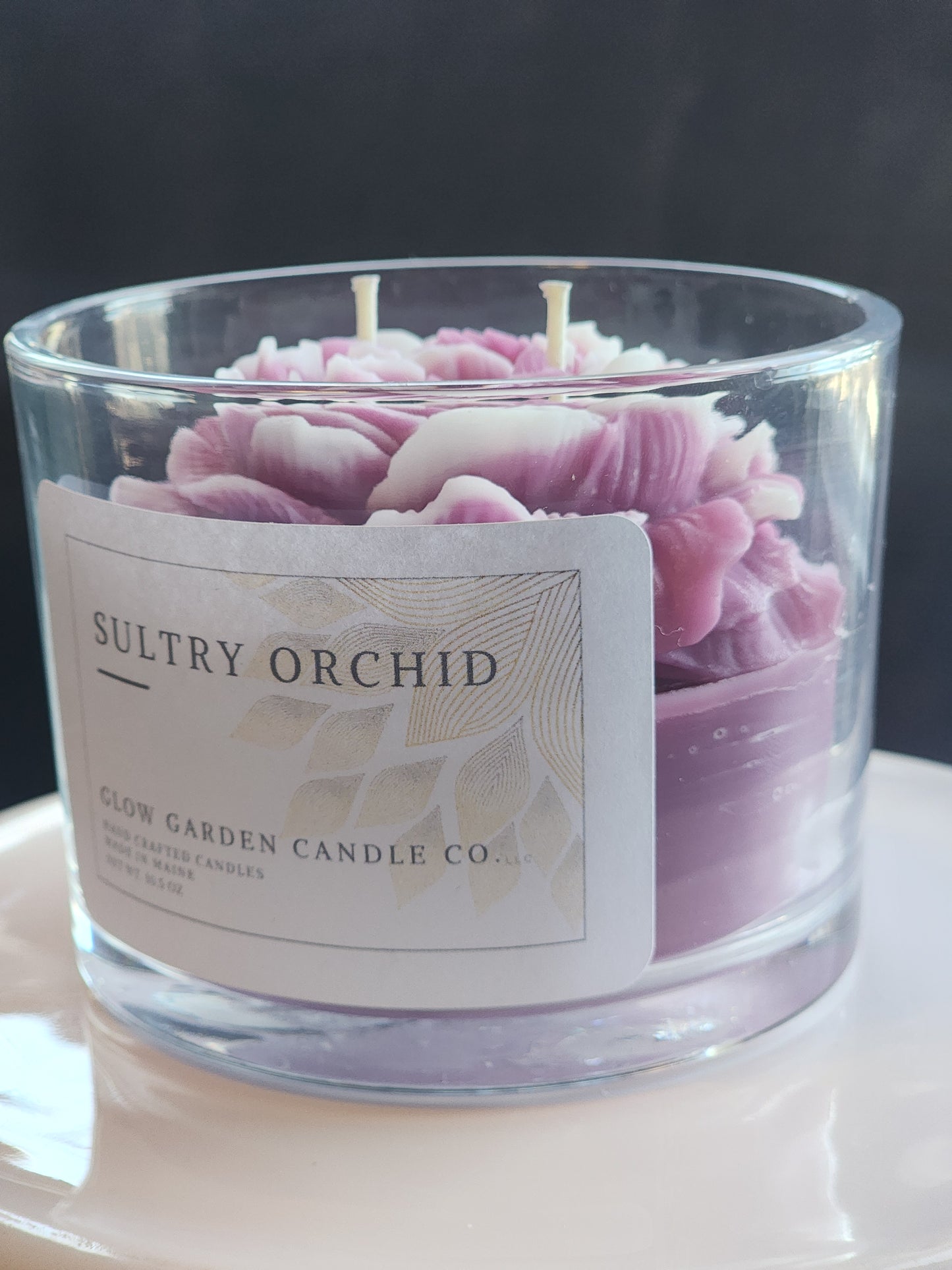 Sultry Orchid 10.5 oz candle with flower